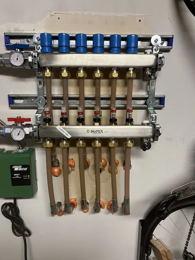 Plumber performing Water Heater Repair at a residential property in Owasco